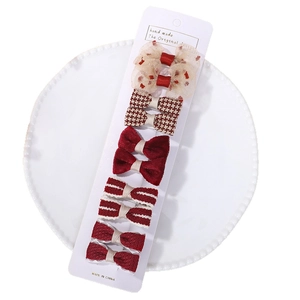 10-piece set of red kids hair clips with plaid and mesh patterns on a display card
