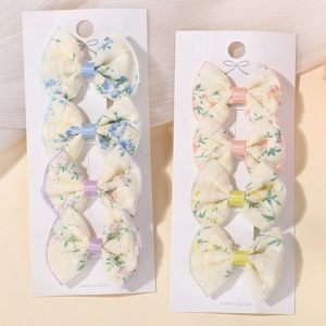8-piece handmade floral bow hair clip set for girls with embroidered lace details