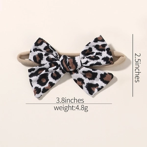 Detail view of infant leopard print bow headband with 3.8 x 2.5 inches dimensions