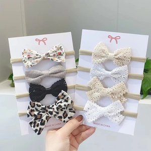 Detailed set of 8 pieces baby bow headbands featuring lace, leopard, and floral patterns