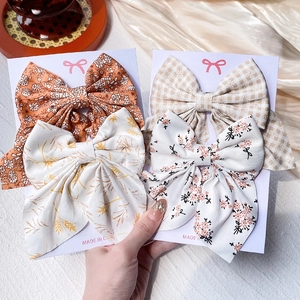 Lot de quatre barrettes à cheveux à nœuds en tissu floral et à carreaux pour enfants