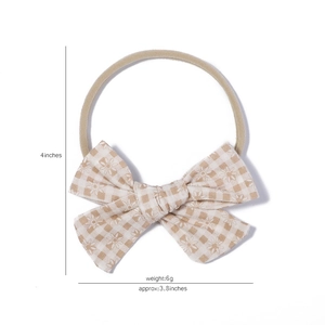 Elastic nylon baby headband with a 4-inch khaki plaid daisy bow for infant girls