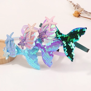 Detail of colorful mermaid headbands with sequins, shells, and stars for girls