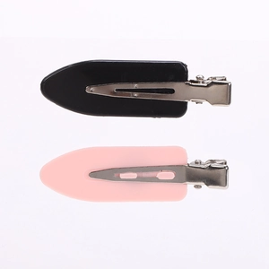 Set of minimalist pink and black creaseless hair clips for makeup styling