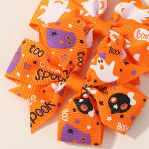 Detail of Halloween grosgrain ribbon bow with ghost and skull prints for hair clips