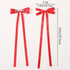 Dettagli del fermaglio a fiocco rosso con misure di 8,7 cm di larghezza e 25,5 cm