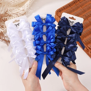 Barrettes à cheveux à double nœud en ruban de satin blanc et bleu sur cartes