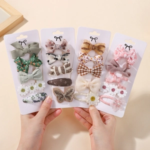 Detailed embroidery and lace fabric hair clips on display cards for girls