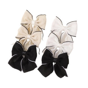 Six-piece solid color fabric bow hair clips with contrast edge stitching for girls