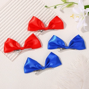 Set of four satin bow hair clips in red and blue colors with silver metal duckbill base