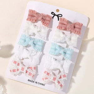 Set of 10 handmade embroidered bow hair clips for girls in pink, white and blue colors