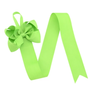 Close-up of neon green ribbed hair bow organizer with dovetail ends on white backdrop