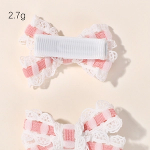Pair of sweet pink checkered bow hair clips with white lace trim and fabric duckbill clips