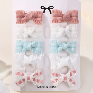 10-piece handmade bow hair clip set for kids with floral embroidery and lace details