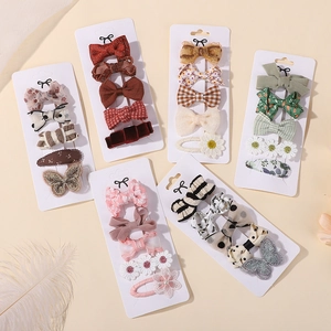 Cute children's hair clip set with floral, bow, and plaid patterns on white cards
