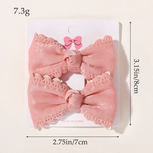 Set di fermagli per capelli con fiocchi rosa e pizzo per bambine su cartoncino