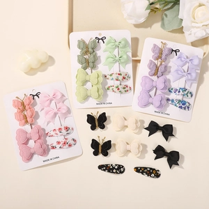 Set mollette capelli per bambini con fiocchi di pizzo e clip floreali su scheda
