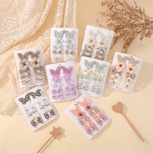 Cute kids hair clip set with floral and bow designs on a display card for girls