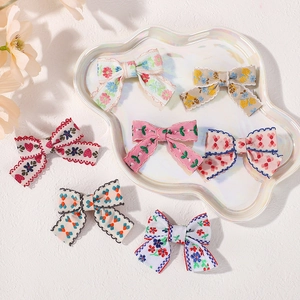 7-piece set of preppy style fabric bow hair clips with embroidery and floral patterns