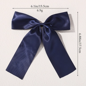 Navy blue satin bow hair clip for girls with long ribbons and smooth silk texture