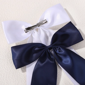 Set of navy blue and white satin bow hair clips with silver alligator metal grips