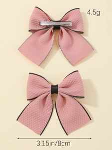 Pink fabric bow hair clips with green edge showing front back view and 8cm size detail
