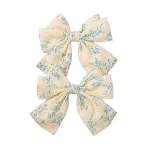 Set di fermagli per capelli a fiocco beige con motivo floreale blu in stile vintage