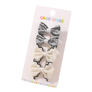Set of 4 handmade lace bow hair clips in black and white with satin ribbon centers