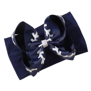 Bandeau élastique pour bébé avec nœud côtelé bleu marine et motifs festifs blancs