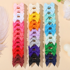 Set of 30 colorful grosgrain ribbon bow hair clips for girls in various vibrant shades