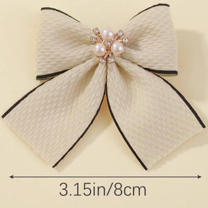 Pince à cheveux nœud beige de 8cm avec bordure noire, perles et strass élégants