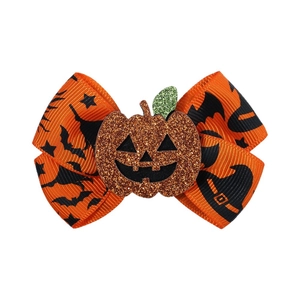 Halloween orange bow hair clip with black bat prints and sparkling pumpkin center