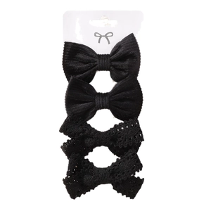 4-piece black children's hair clip set with lace bows on a white display card