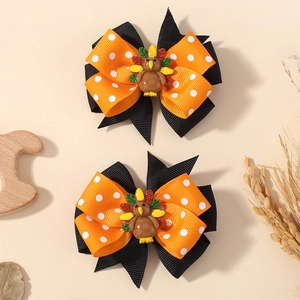 Paire de barrettes dinde de Thanksgiving avec nœuds orange sur fond sur le thème automne