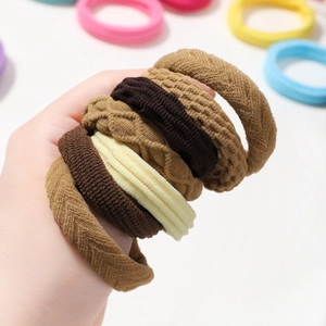 Close-up of high elasticity brown hair ties featuring various knit and woven textures