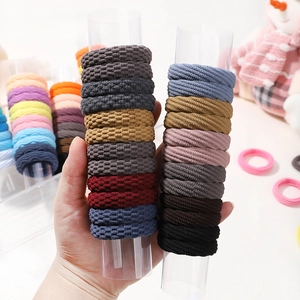 Detail of high-elasticity hair ties with honeycomb and threaded weaving textures
