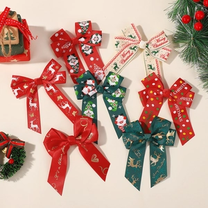 Detailed view of Christmas ribbon hair clips with elk and polka dot patterns for kids