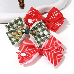 Three-piece Christmas JOJO hair bow set with festive ribbed ribbon and merry patterns