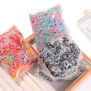 Three packs of high-elasticity colorful disposable rubber hair bands in a wooden tray