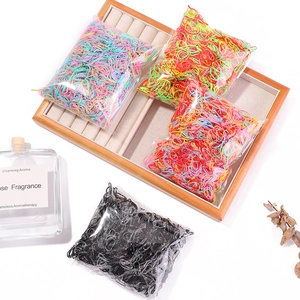 Detail of high elasticity disposable hair ties in four different color packs