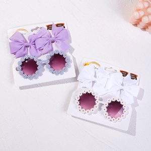 Détail de lunettes marguerite et pinces à cheveux à nœud pour filles de 2 à 10 ans