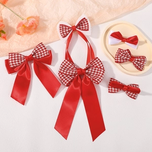 Detailed set of red and houndstooth bow hair clips with long ribbons for girls