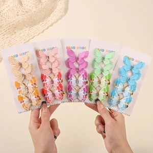 Set mit bunten Schmetterlings-Haarspangen mit glitzerndem Stoff und Strass für Kinder