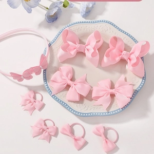 9-piece pink bow hair accessory set for girls including headband and bow clips
