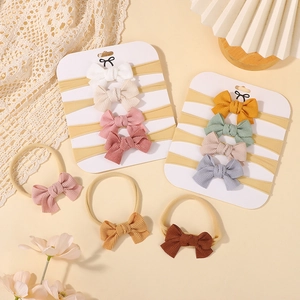 Set of baby nylon headbands with cute striped fabric bows in soft Morandi colors