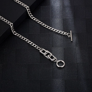 Macro detail of silver stainless steel curb chain with toggle clasp and hollow rectangle link