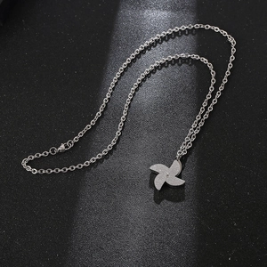 Minimalist spinning windmill pendant necklace in silver stainless steel with glitter finish