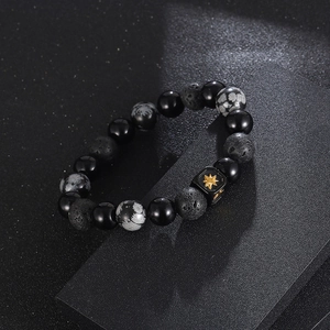 Black Onyx and Snowflake Obsidian beaded bracelet with golden star charm cube