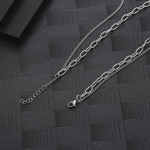 Detail shot of double-layered titanium steel chain with lobster clasp and extension link