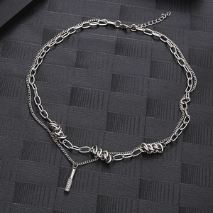 Double-layer titanium steel necklace with thorn twist links and rhinestone cylinder pendant